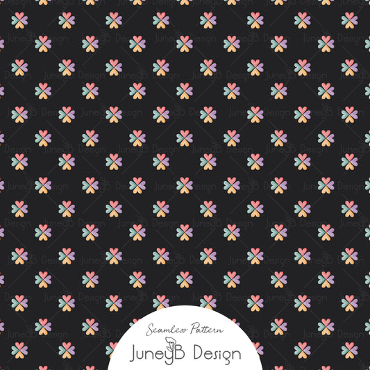 80s mini floral seamless pattern with coral, teal, lavender, and mustard flowers on a black background.