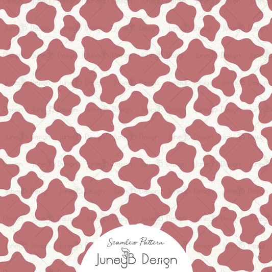 Pink cowgirl seamless cow print pattern with irregular hide style spots on cream background.